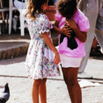 Girl grabbing pigeon Girl grabbing pigeon